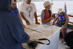 Locating landmarks and later finding the church spire on the chart.