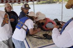 Two Brooklin students at the helm, under the guidance of Capt. Parker